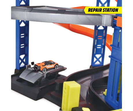 Close-up of the Dickie Parking Station Garage repair station showing an orange sports car on a raised grey vehicle platform.