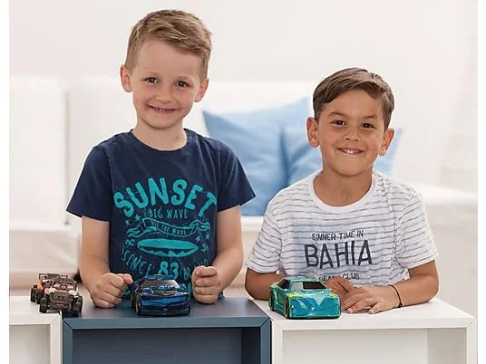 Two children playing with three Dickie Toys Joyrider cars