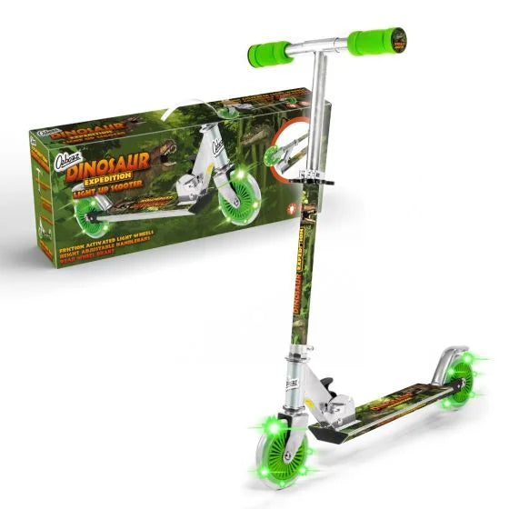 Product box and assembled dinosaur themed scooter featuring green grips, printed deck, and green light up wheels.