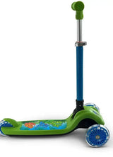 A side view of the green scooter showing the full deck artwork with cartoon dinosaurs and clear blue wheels
