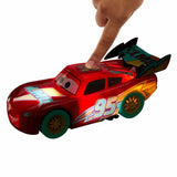 Finger pressing the roof button on Disney Cars Light Up Lightning McQueen