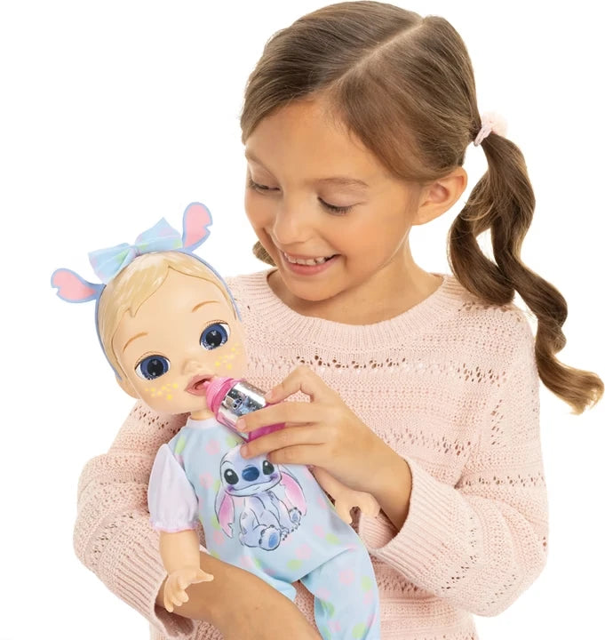 Child holding the Stitch bottle to the Disney Darlings Stitch Blonde Doll