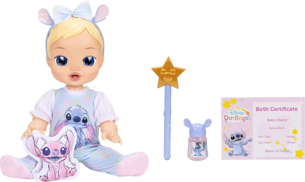 Disney Darlings Stitch Blonde Doll seated beside pink character cushion, star wand, Stitch bottle and birth certificate