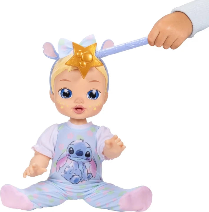 Gold star wand touching the Disney Darlings Stitch Blonde Doll's forehead with yellow stars visible on her cheeks