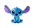 Front view of Disney Doorables Stitch plush toy with large glittery eyes and wide purple ears sitting upright on white background