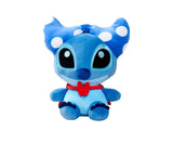 Disney Doorables Stitch 25 cm plush toy in blue with white polka dot bow and red scarf, seated on white background.