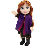 Disney Frozen Anna Toddler Doll in purple cape with one hand raised