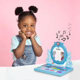 Child beside Disney Frozen cosmetic vanity set with mirror, makeup tray and music notes graphic