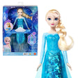Disney Frozen Light-Up Singing Elsa Doll beside its display box, wearing a blue dress with a blonde braid.
