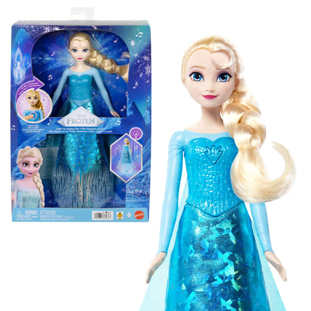 Disney Frozen Light-Up Singing Elsa Doll beside its display box, wearing a blue dress with a blonde braid.
