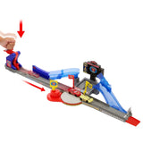 Disney Pixar Cars track playset with hand placing red car on launcher and black car on blue ramp