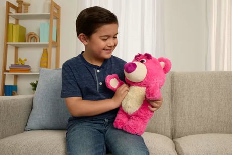 Disney Pixar Toy Story 30th Anniversary Lotso Feature Plush on a sofa with a child