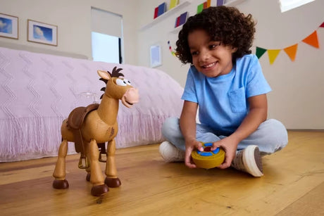 Child playing with Toy Story Bullseye RC figure and horseshoe remote