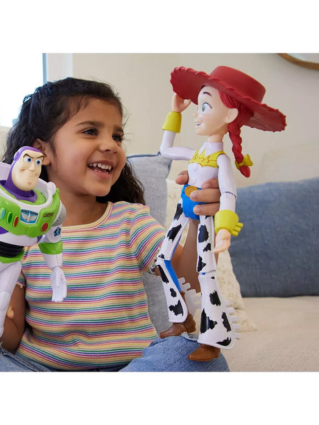 Child holding Disney Pixar Toy Story Jessie and Buzz Lightyear figures