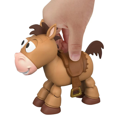 Hand pressing the saddle on Toy Story Bullseye figure