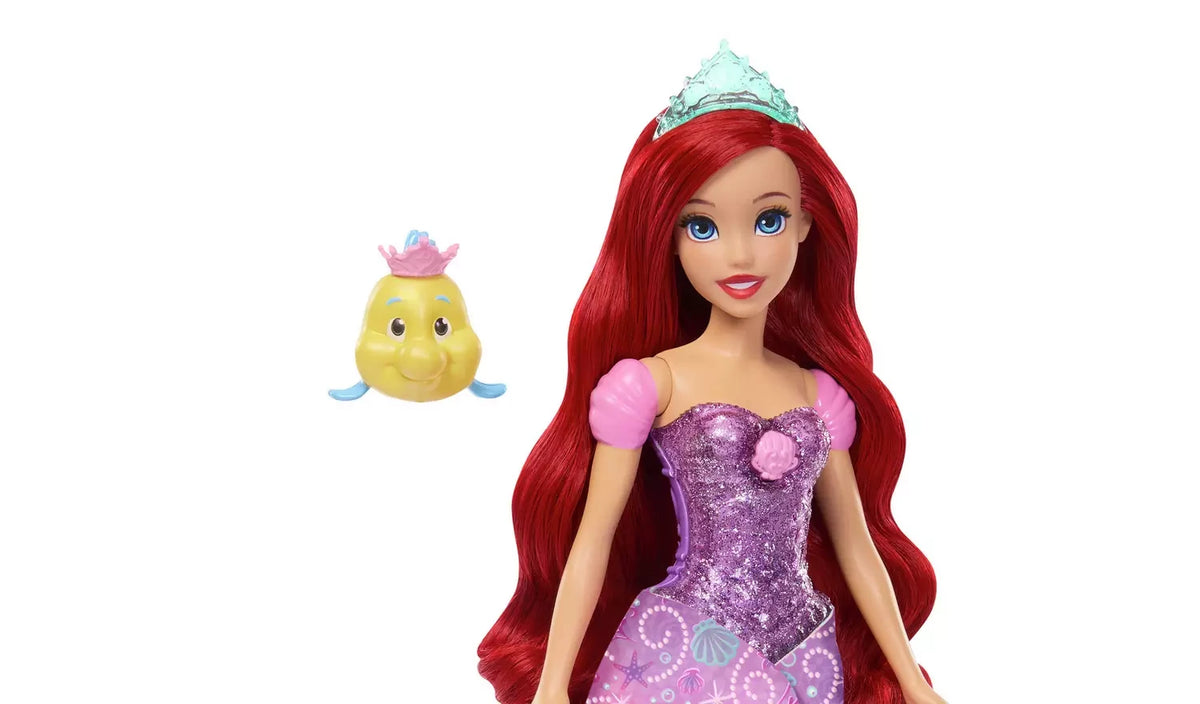 Disney Princess Ariel with long red hair, sparkling purple bodice, tiara and Flounder