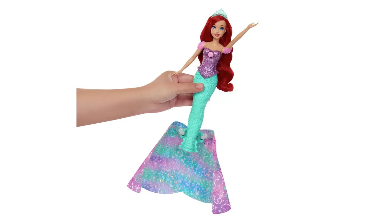 Disney Princess Ariel held upright with turquoise mermaid tail extended above shimmering skirt