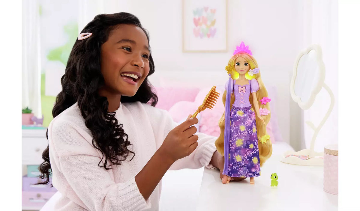 Disney Princess Magical Hair Rapunzel Fashion Doll being styled with the included brush