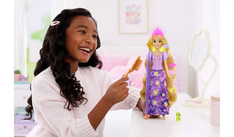 Disney Princess Magical Hair Rapunzel Fashion Doll being styled with the included brush