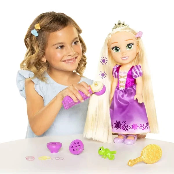 Child using the purple styling tool on Rapunzel's long blonde hair with sun patterns visible