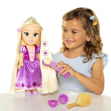 Child using the purple styling tool on Rapunzel's blonde hair with purple sun designs visible
