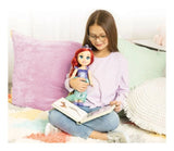 Disney Princess My Friend Ariel Doll held by a child reading on a bed