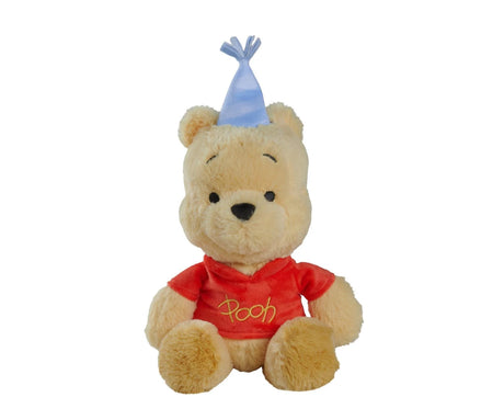 Disney Winnie the Pooh Anniversary 25cm plush seated front-facing view wearing a red Pooh-embroidered top and a light blue party hat