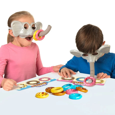 Two children playing Doh Nutters using elephant masks to move doughnuts onto their game boards