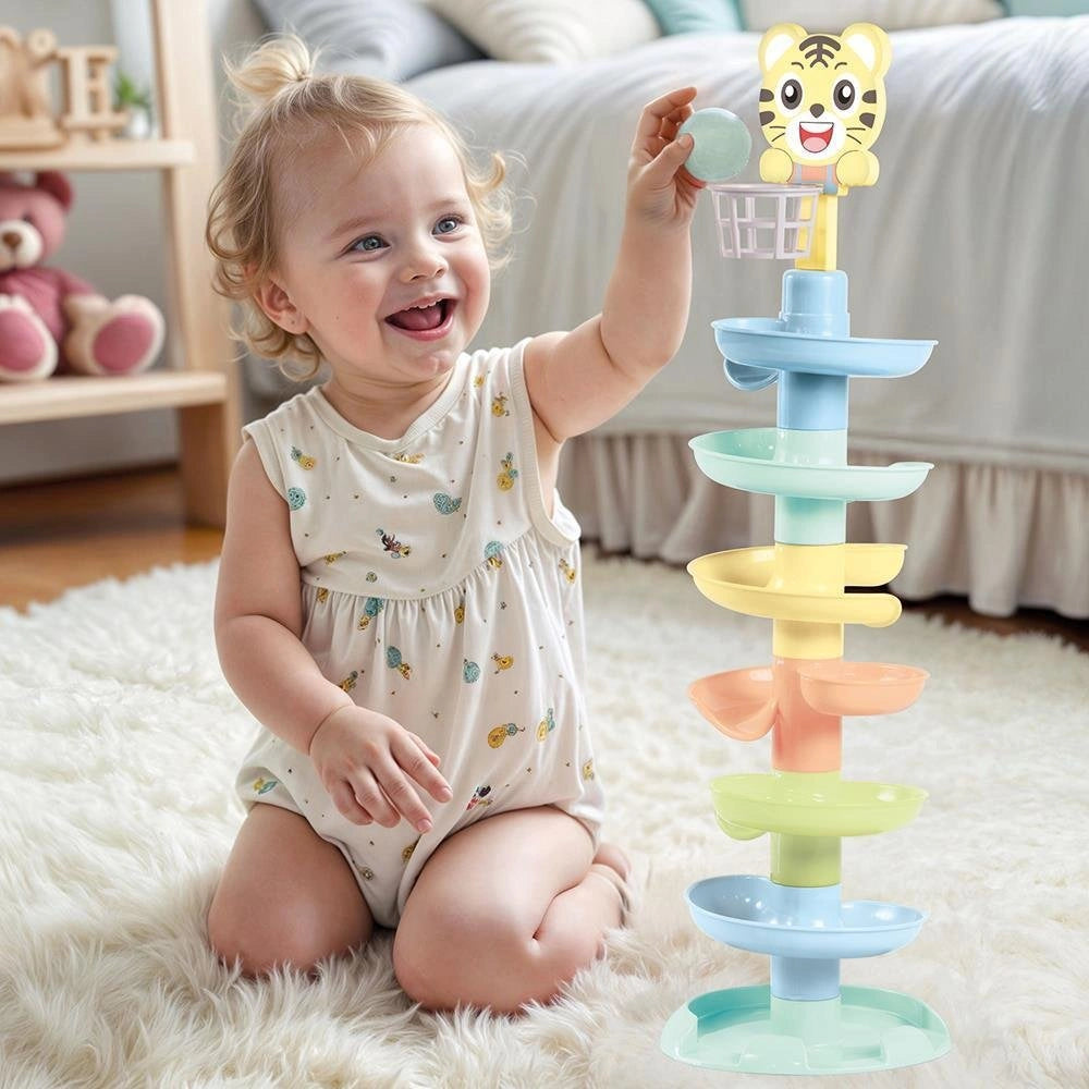Dolu Ball Tower XL shown beside a child holding a ball above the top basket