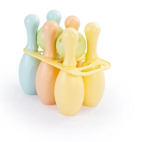 Pastel coloured bowling pins and balls grouped together on a white background