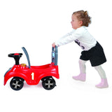Child pushing a red Dolu sit n ride car on a white background