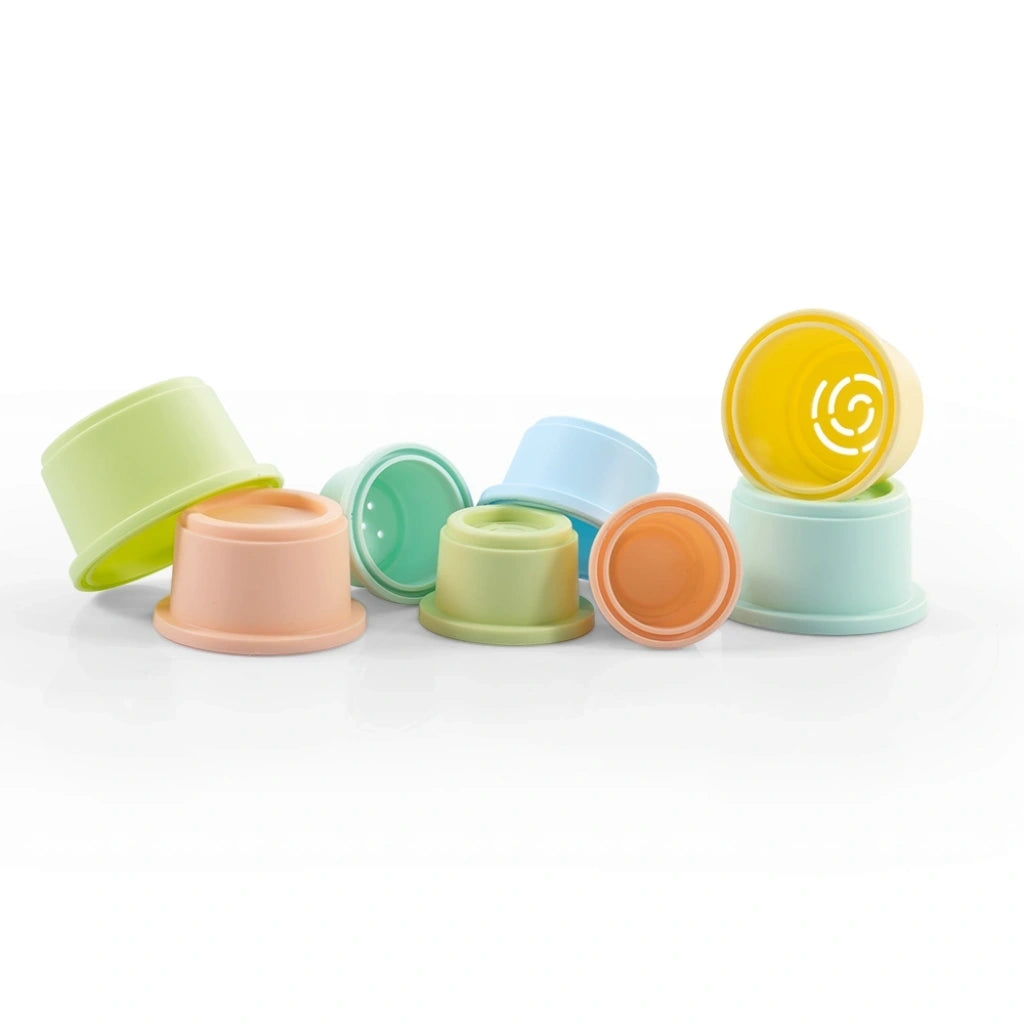 Dolu Round Stacking Cups laid out in different sizes and pastel colours