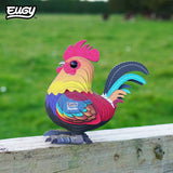 EUGY Rooster model standing outdoors on a wooden fence