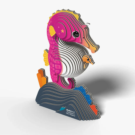 EUGY Seahorse 3D cardboard model viewed from the right with visible layered construction, yellow fins, baby seahorse and dark blue coral base