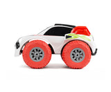 Exost Mini Flip stunt car side view showing large red wheels and black body