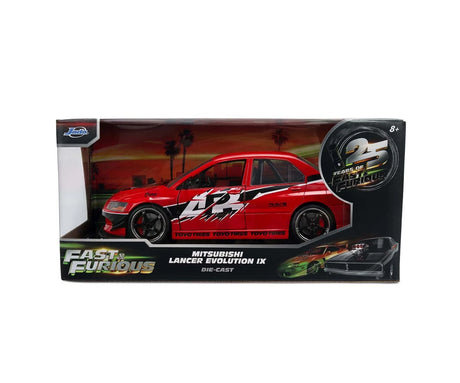 Fast & Furious Mitsubishi Lancer Evolution IX diecast car displayed inside Jada Toys retail packaging with movie branding and 25 Years of Fast & Furious logo.