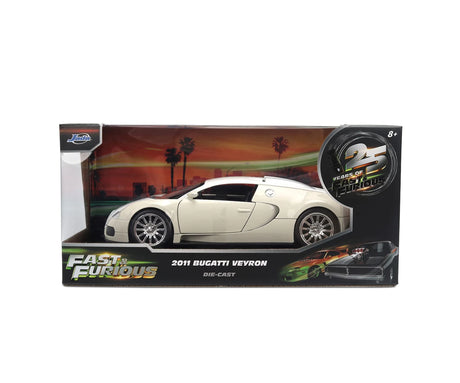 Fast & Furious 2011 Bugatti Veyron diecast model displayed in Jada Toys retail packaging with 25 Years of Jada branding and sunset background artwork.