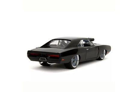 Fast & Furious Fast X 1970 Dodge Charger diecast car rear three-quarter view showing black bodywork, chrome rear bumper, red tail lights and detailed alloy wheels