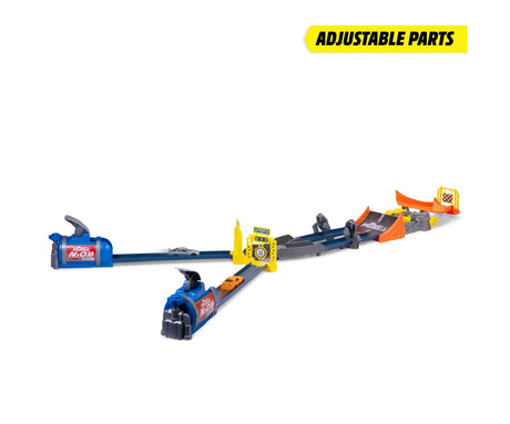 Fast & Furious Nitro Blast adjustable track layout showing two blue launchers, yellow starting gate, twin blue lanes, central crash mechanism and orange jump ramp, with orange and silver cars positioned on the starting tracks.