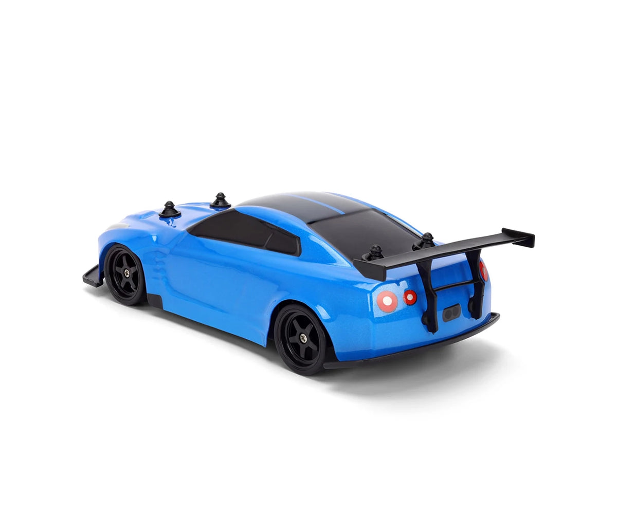 Blue Fast & Furious RC Nissan GT-R R35 viewed from the rear and side, showing black wheels, tinted windows, rear lights and large black rear wing.