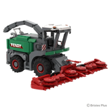 Front left view of the BRIXIES Plus Fendt Katana 65 showing the wide red harvesting header, cab, green forage harvester body and raised discharge spout