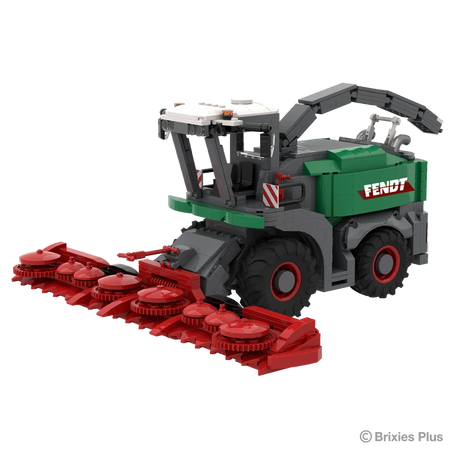 Front right view of the BRIXIES Plus Fendt Katana 65 showing the wide red harvesting header, enclosed cab, green body and raised discharge spout