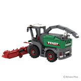 Rear right view of the BRIXIES Plus Fendt Katana 65 showing the green rear body, raised discharge spout, red rimmed wheels and harvesting header extending left