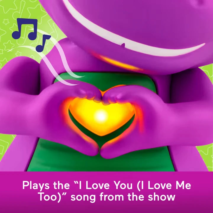 Close-up of Barney forming a heart shape with his hands around the illuminated yellow heart on his chest