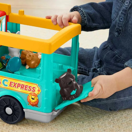 Child placing an animal figure into the Fisher Price Little People Big ABC Animal Train