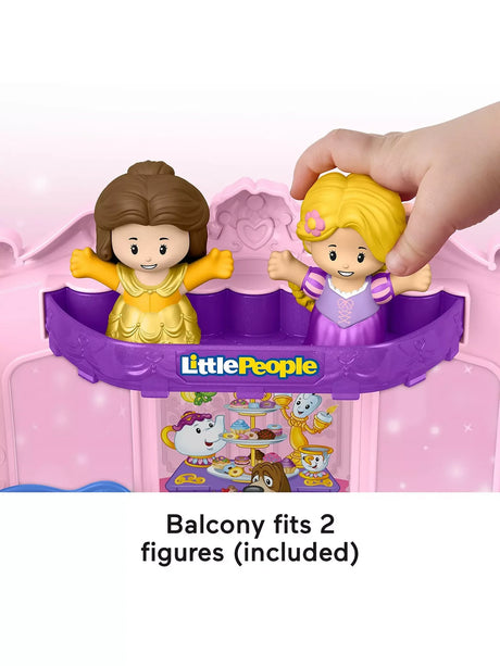 Fisher Price Little People Disney Princess Belle and Rapunzel figures on purple balcony of musical carriage playset
