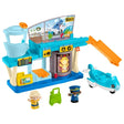 Fisher-Price Little People airport playset assembled with toy plane, two figures and green luggage piece