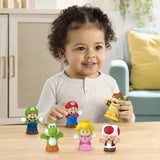 Child at a table with Mario, Luigi, Bowser, Princess Peach, Yoshi and Toad Little People figures