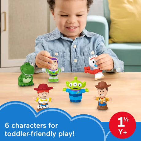 Child playing with Fisher-Price Little People Toy Story figures including Rex, Buzz Lightyear, Jessie, Alien, Woody and Forky