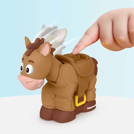 Close up of finger pressing the button on the Bullseye figure